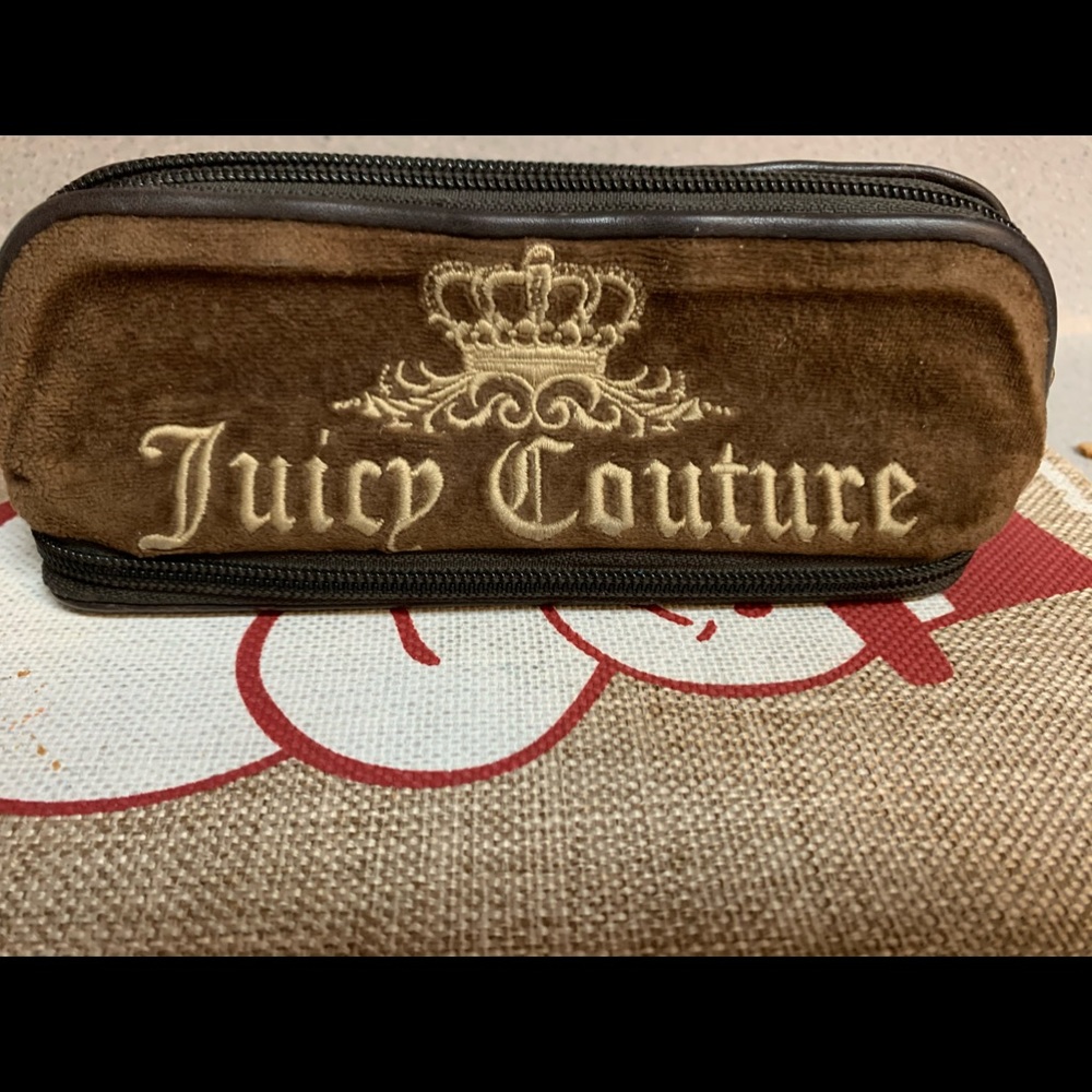 Juicy couture small case roomy for its size with bottom compartment